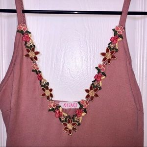 Pink bodysuit with flower detail